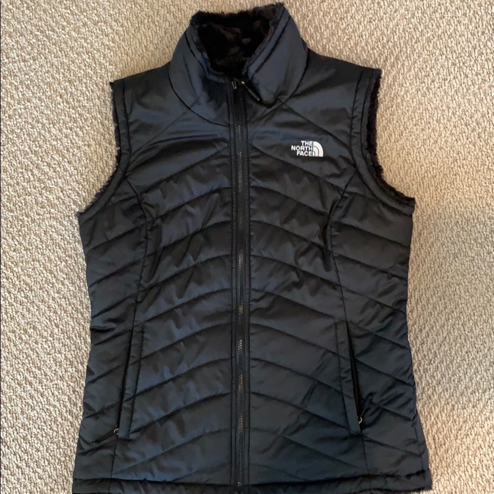 Woman’s black reversible Northface vest